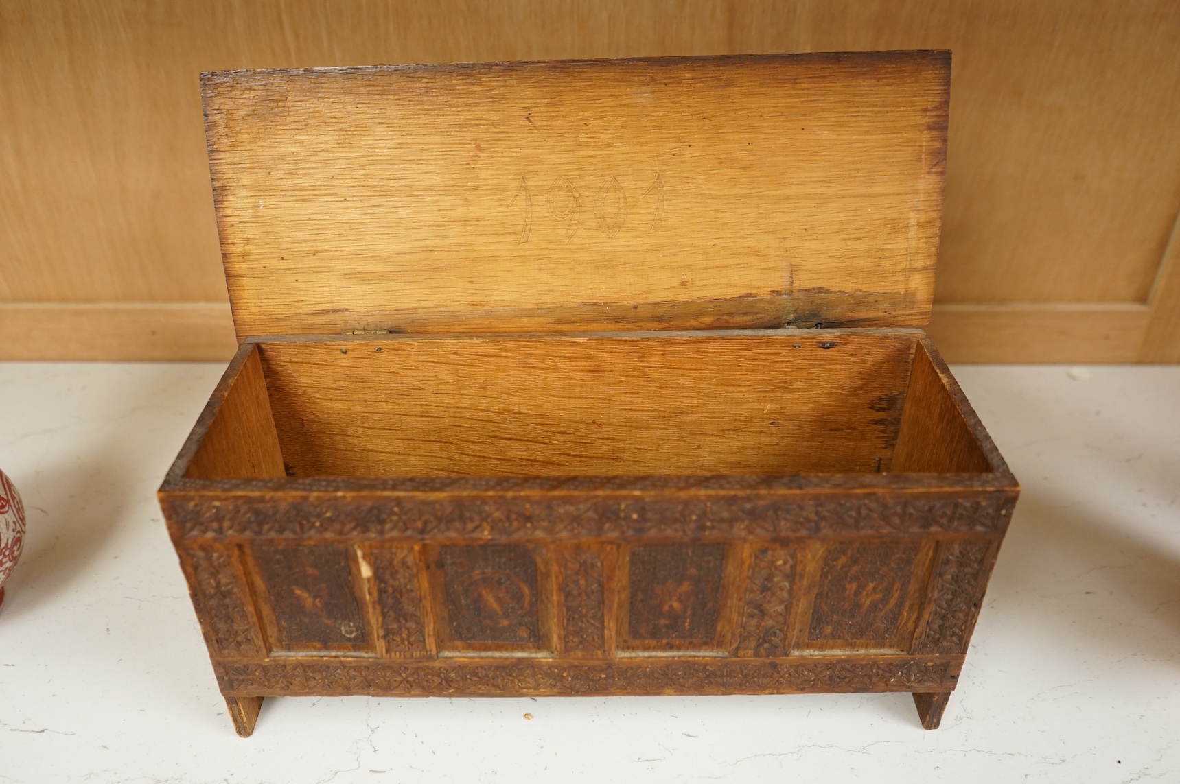 A chip-carved oak miniature coffer with incised date 1901 to the interior, 28cm wide